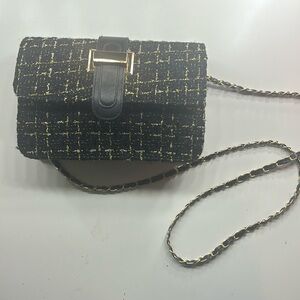 Black purse with gold accents